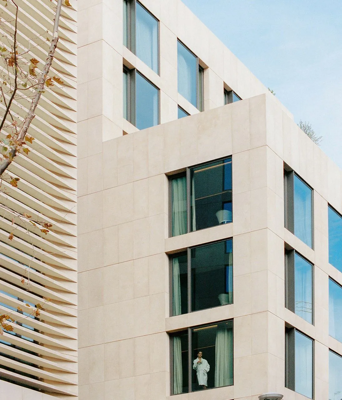 ME Barcelona hotel facade with bush-hammered Perla sandstone in large-format pieces